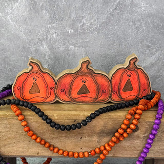 Small Jack-O-Lantern in a Row Doodle Sitter